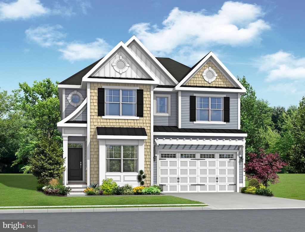 view of front of house featuring a garage and a front lawn