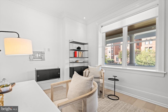 office area with crown molding and hardwood / wood-style floors