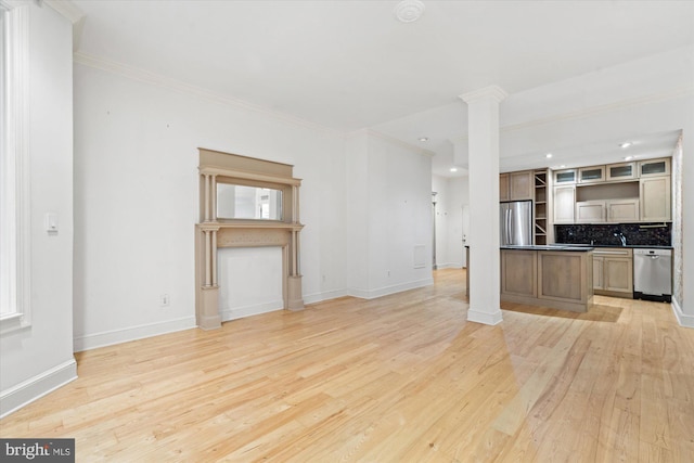 unfurnished living room featuring ornamental molding, light hardwood / wood-style flooring, and ornate columns