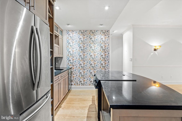 kitchen featuring stainless steel fridge, light hardwood / wood-style floors, electric range, and a center island