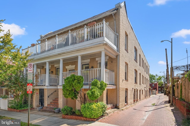 view of front of house featuring a balcony