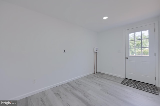 doorway with light hardwood / wood-style flooring