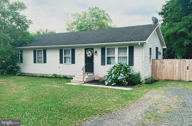 single story home featuring a front lawn