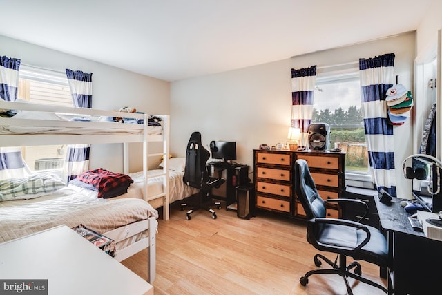 bedroom with hardwood / wood-style floors