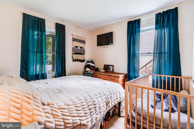 bedroom with light wood-type flooring