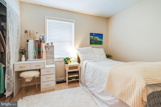 bedroom with light wood-type flooring