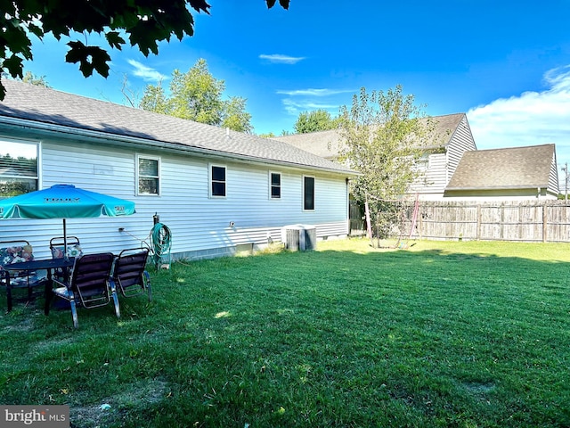 rear view of house with a lawn