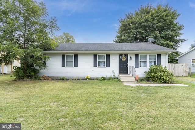 single story home with a front lawn