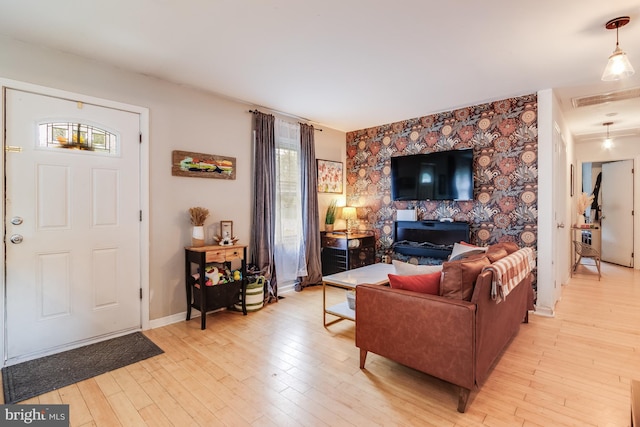 living room with a fireplace and light hardwood / wood-style flooring