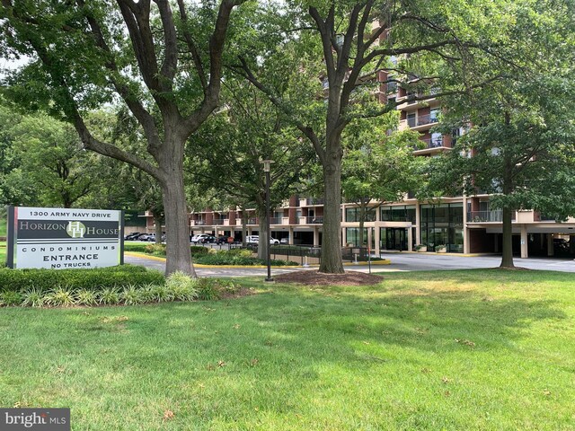 view of home's community featuring a lawn