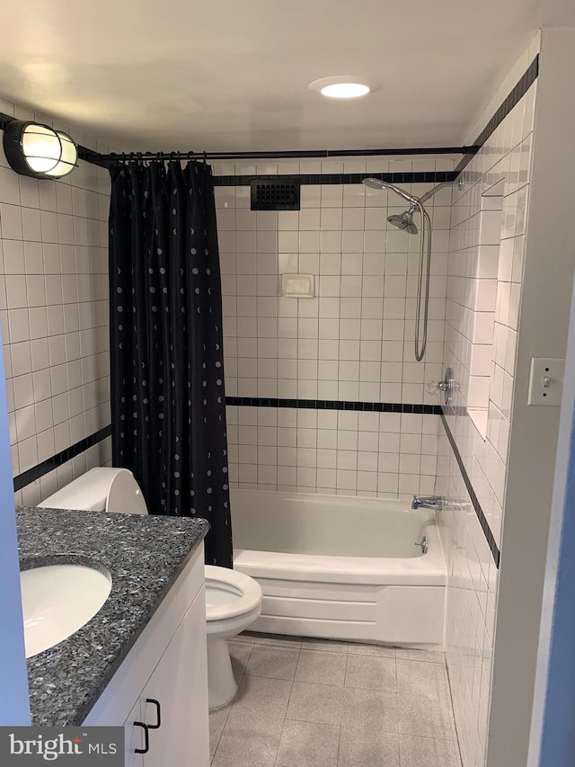 bathroom with toilet, vanity, shower / bath combination with curtain, and tile patterned floors