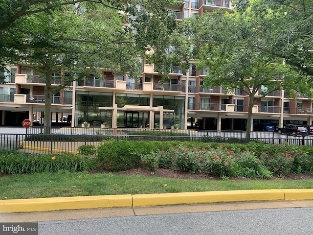 view of building exterior featuring fence