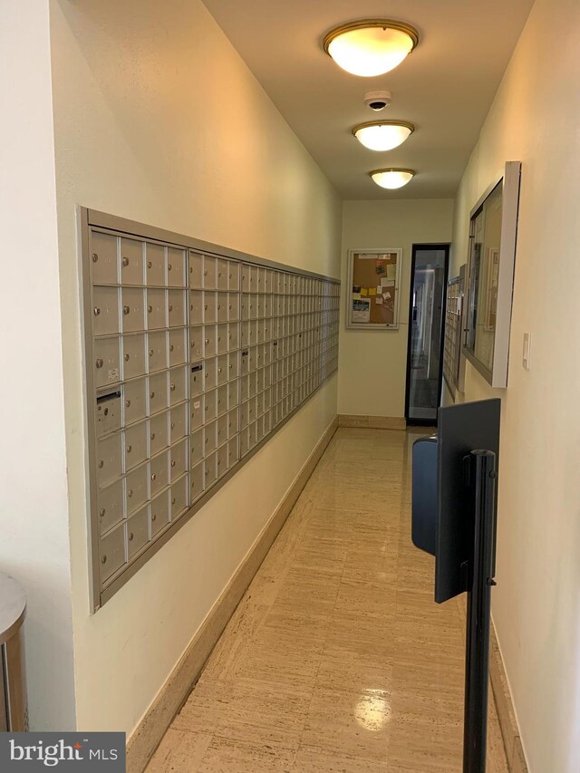 hallway featuring baseboards