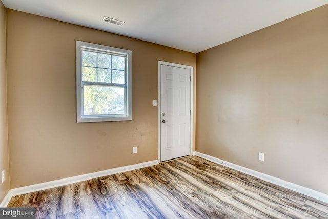 spare room with light hardwood / wood-style floors