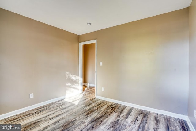 empty room with light hardwood / wood-style floors