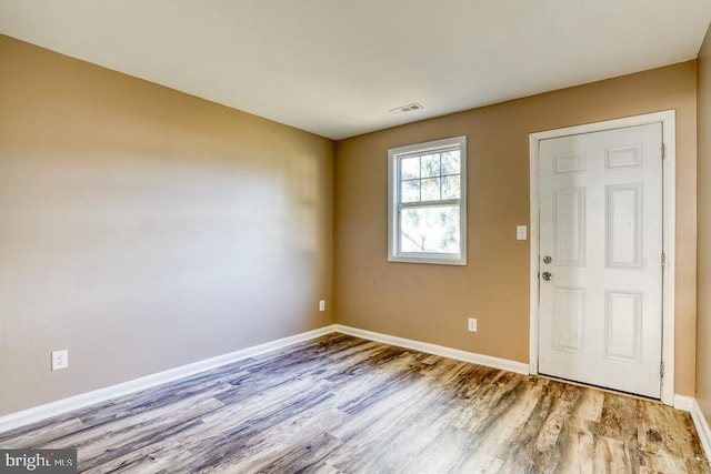 entrance foyer with light hardwood / wood-style floors