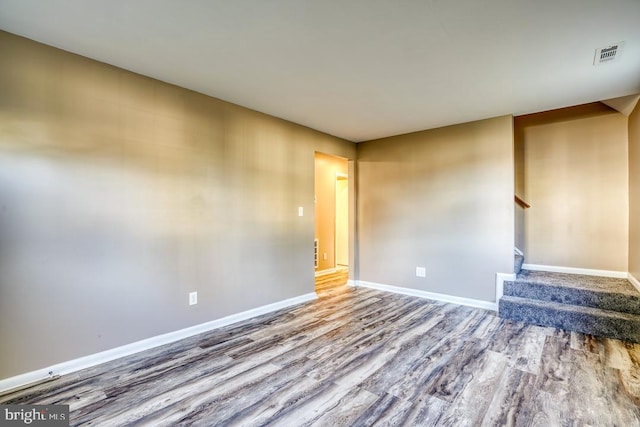 spare room with hardwood / wood-style floors