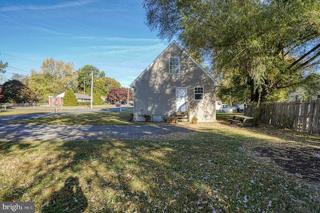 view of property exterior featuring a yard