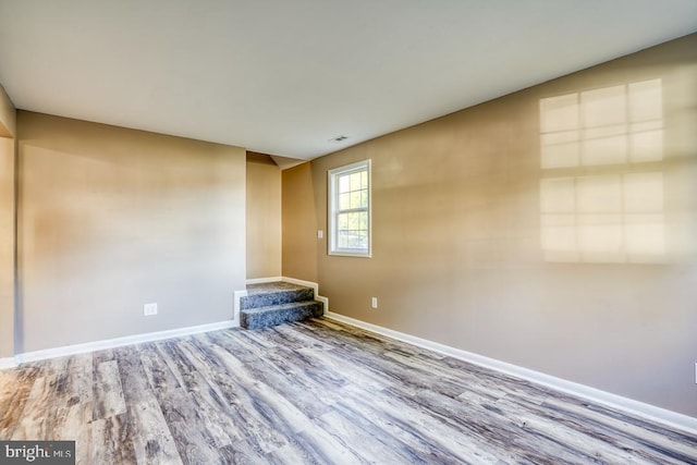 unfurnished room featuring hardwood / wood-style floors