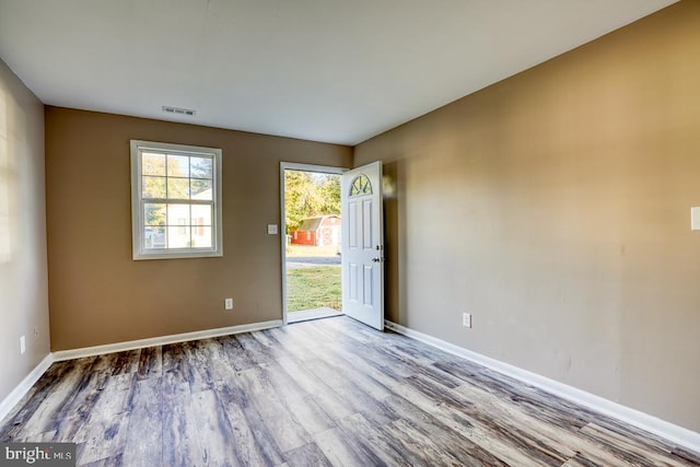 empty room with wood-type flooring