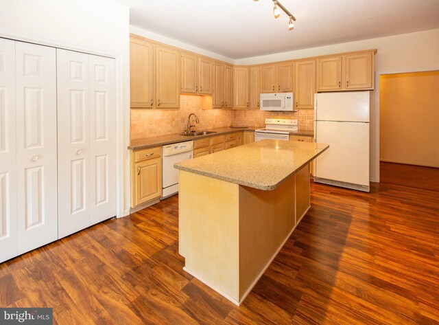 laundry room featuring light hardwood / wood-style floors, cabinets, and washer and clothes dryer