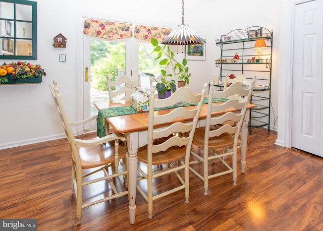 dining space featuring dark hardwood / wood-style floors