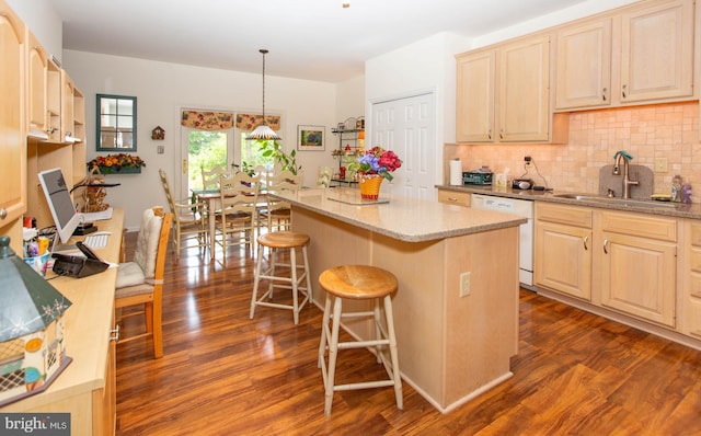 kitchen with a kitchen island, sink, dark hardwood / wood-style floors, and dishwasher