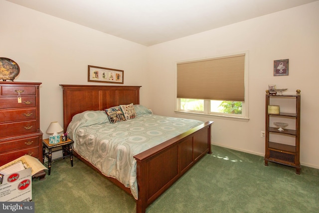 bedroom with dark colored carpet