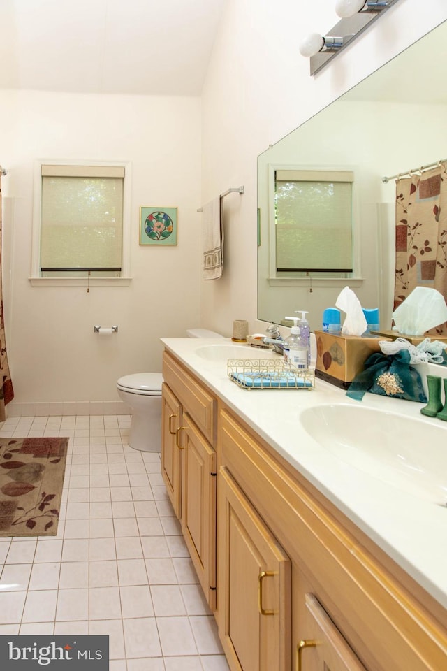 bathroom featuring vanity, tile patterned flooring, toilet, and a shower with shower curtain