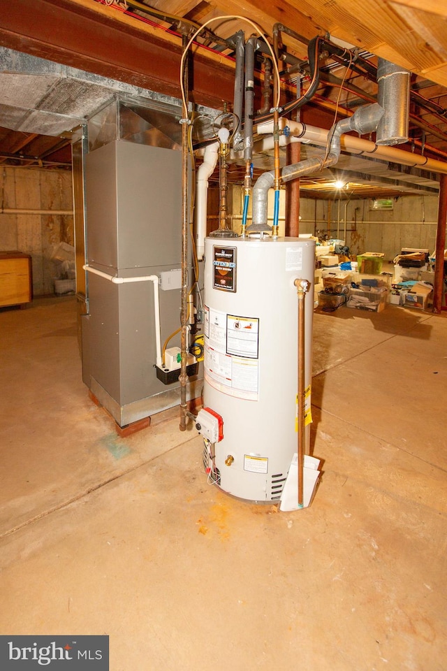 utility room featuring gas water heater and heating unit