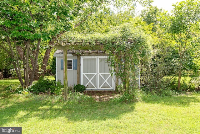 view of outdoor structure with a lawn