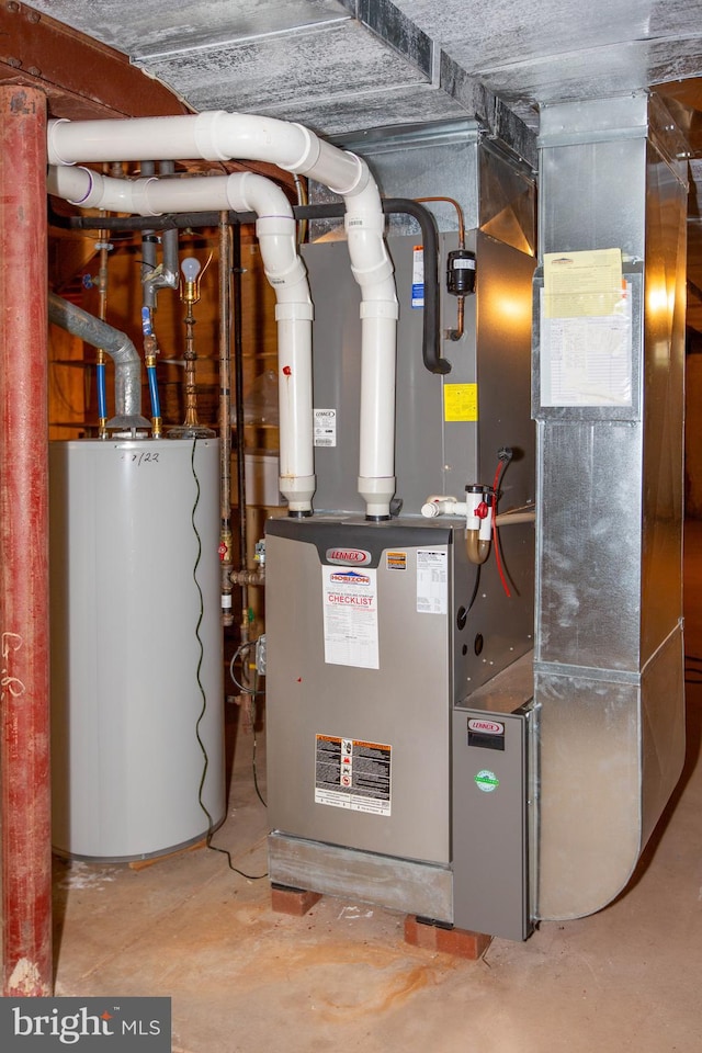 utility room featuring gas water heater and heating unit