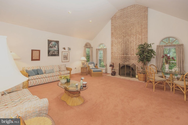 living room with a fireplace, carpet floors, high vaulted ceiling, and a wealth of natural light