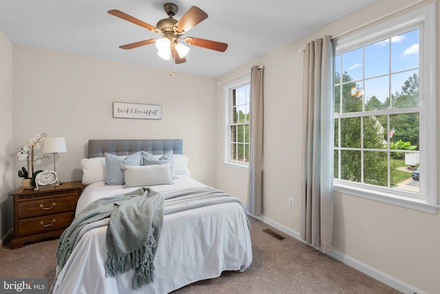 bedroom featuring ceiling fan and carpet flooring