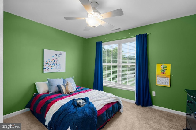 carpeted bedroom with ceiling fan