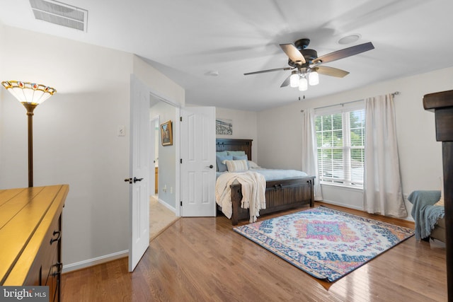 bedroom featuring hardwood / wood-style floors and ceiling fan