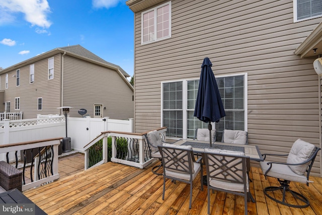 wooden deck featuring central air condition unit and an outdoor hangout area