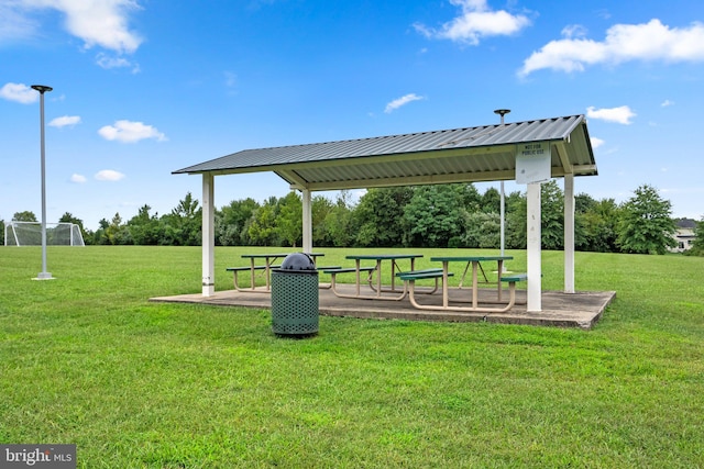 surrounding community featuring a lawn and a patio area