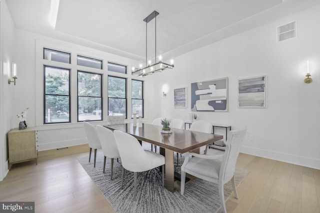 4428 Albemarle St NW, Washington, DC 20016 - dining space featuring a chandelier, baseboards, and light wood-style flooring