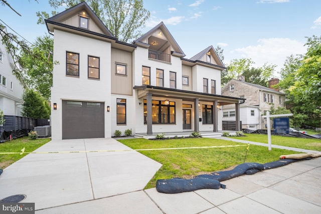 4428 Albemarle St NW, Washington, DC 20016 - view of front of property featuring a front yard, concrete driveway, covered porch, an attached garage, and cooling unit