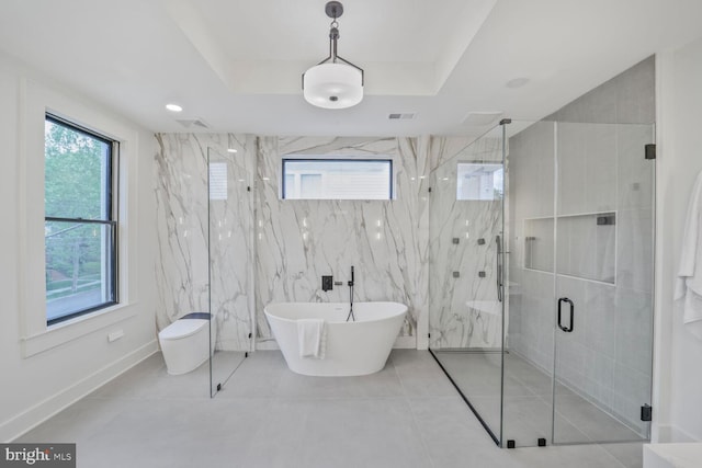 4428 Albemarle St NW, Washington, DC 20016 - bathroom with a marble finish shower, a soaking tub, and tile patterned floors