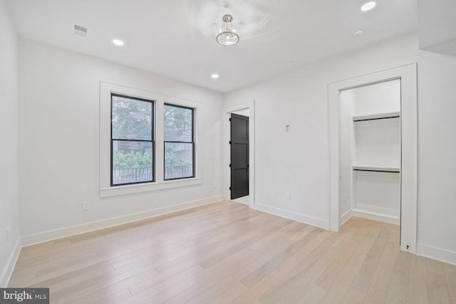 4428 Albemarle St NW, Washington, DC 20016 - unfurnished bedroom featuring light wood-type flooring, baseboards, a spacious closet, recessed lighting, and a closet
