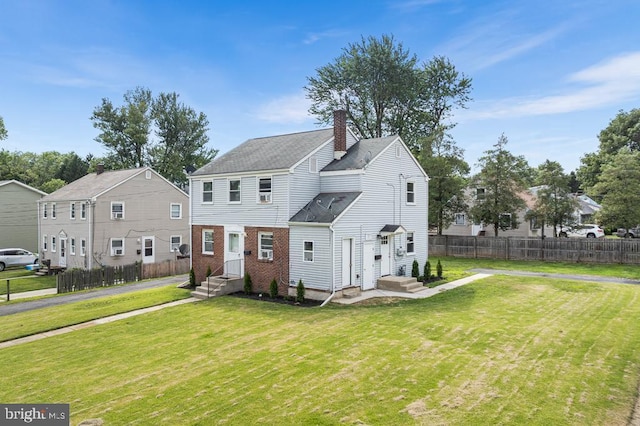 view of front of home with a front lawn