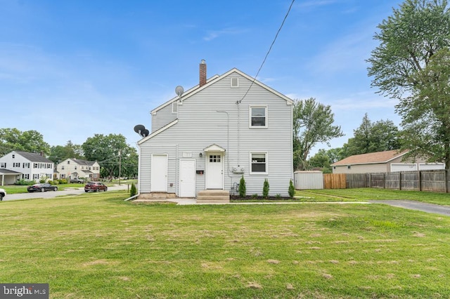 view of front of home with a front lawn