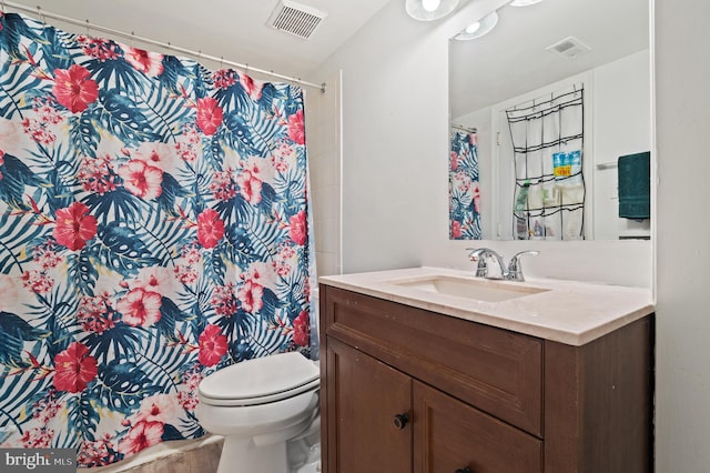 bathroom featuring vanity, toilet, wood-type flooring, and curtained shower