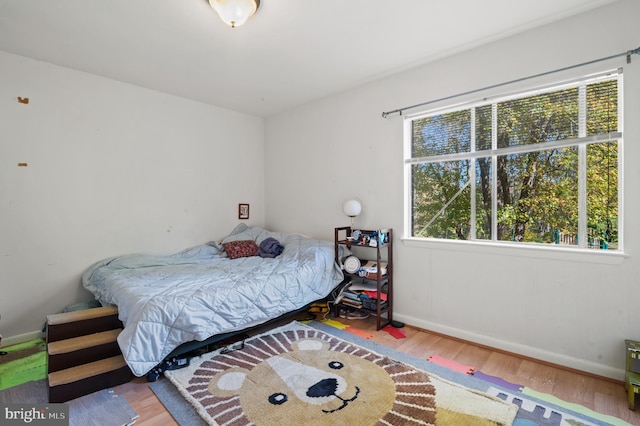 bedroom with wood-type flooring