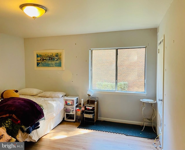 bedroom with light wood-type flooring