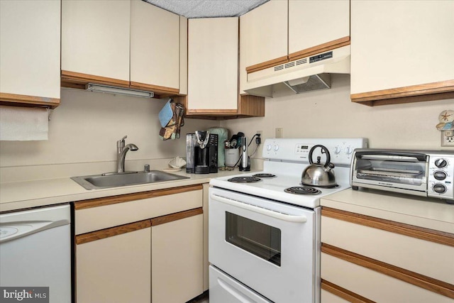 kitchen with white appliances and sink