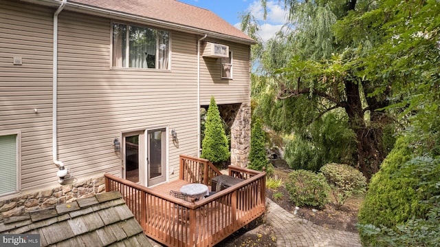 back of house featuring a wooden deck