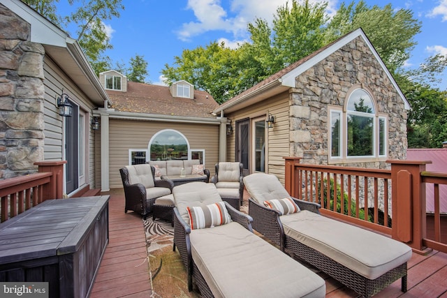 wooden deck with an outdoor living space